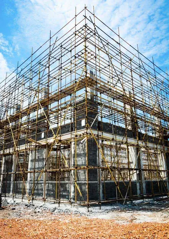 Scaffolding around a building under construction